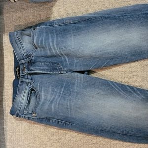 medium wash high rise skinny jeans leg and butt fade